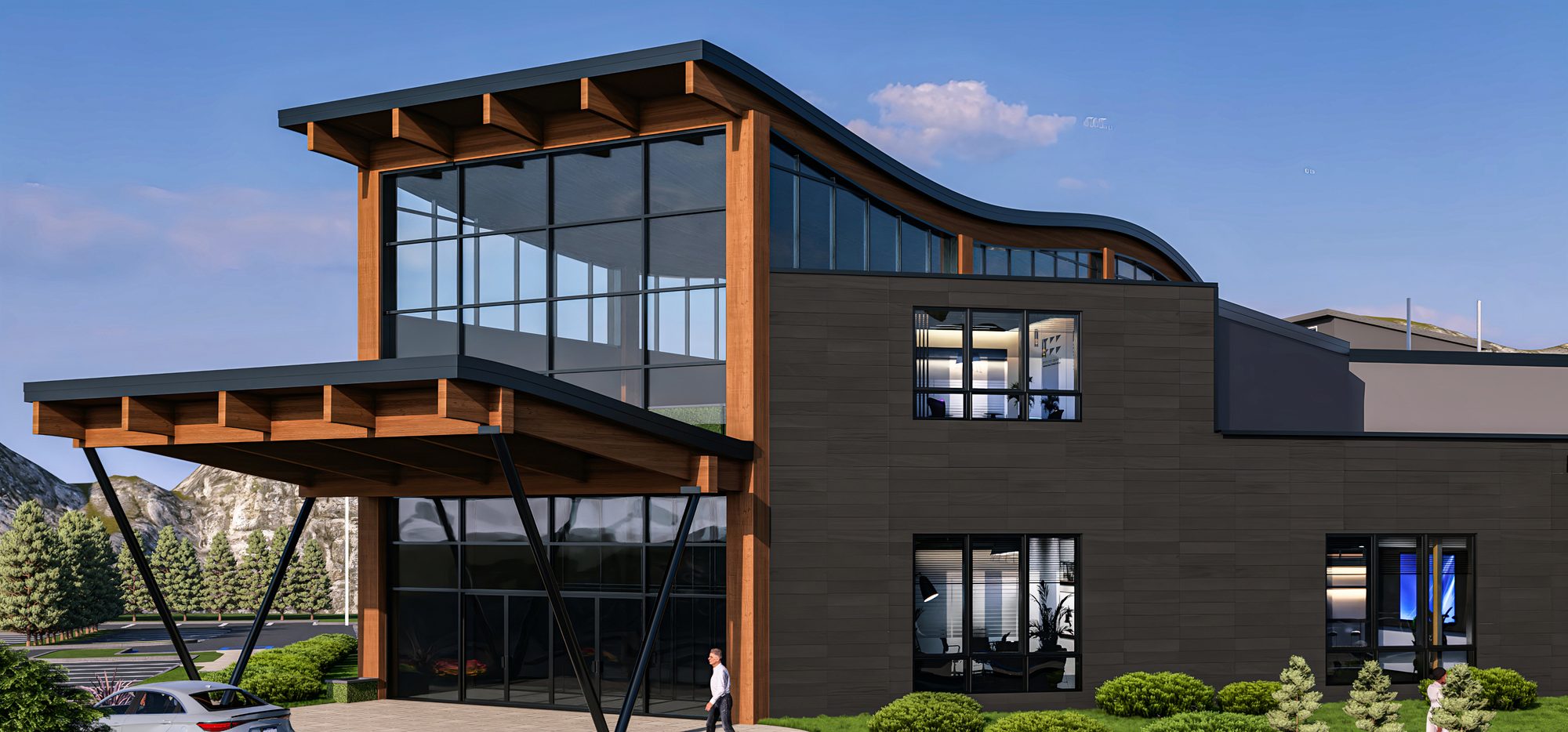 The entrance to Meridian Commons: a curved timber roof over a glass-walled two-storey lobby, with planting and a path leading to the door.
